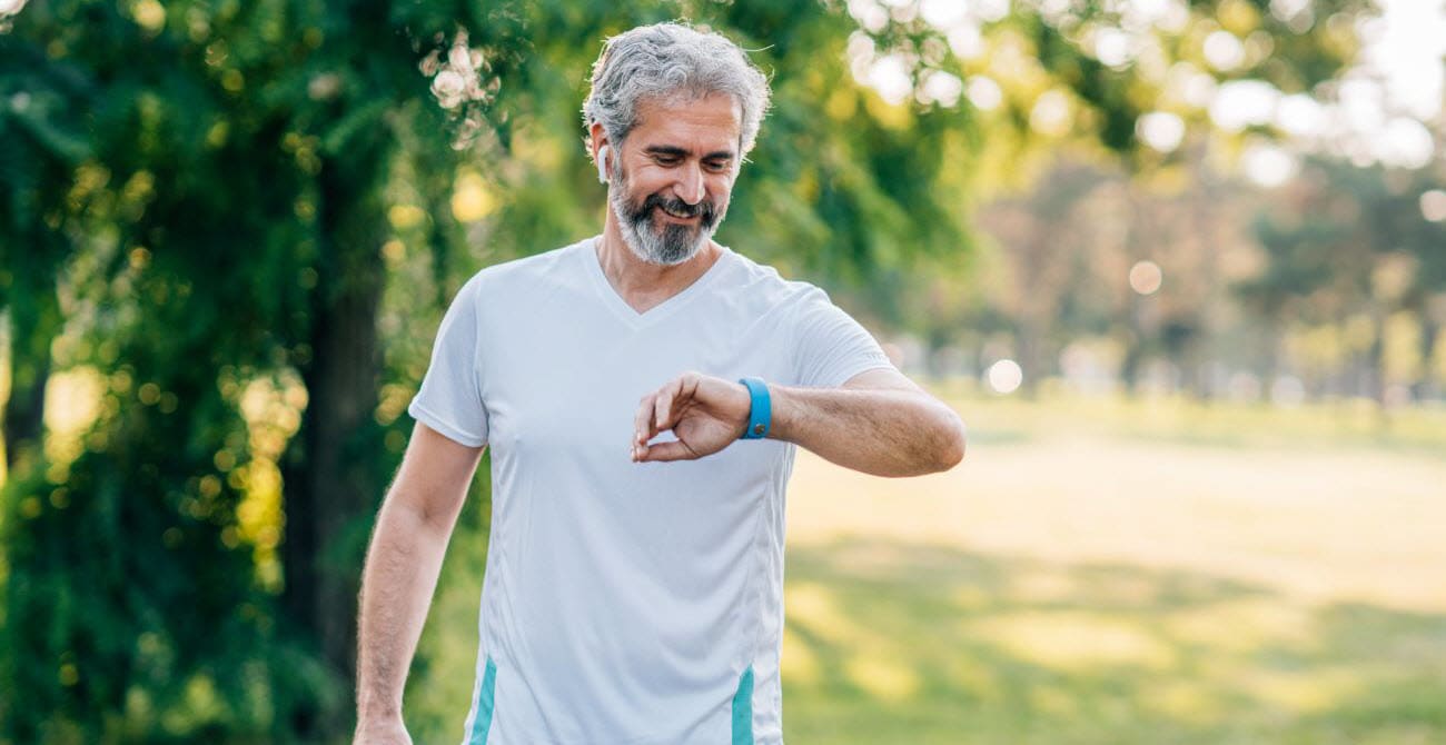 active senior measuring heart rate