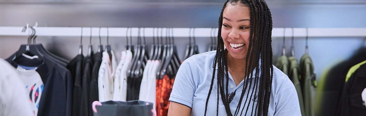 Woman smiling working in a store