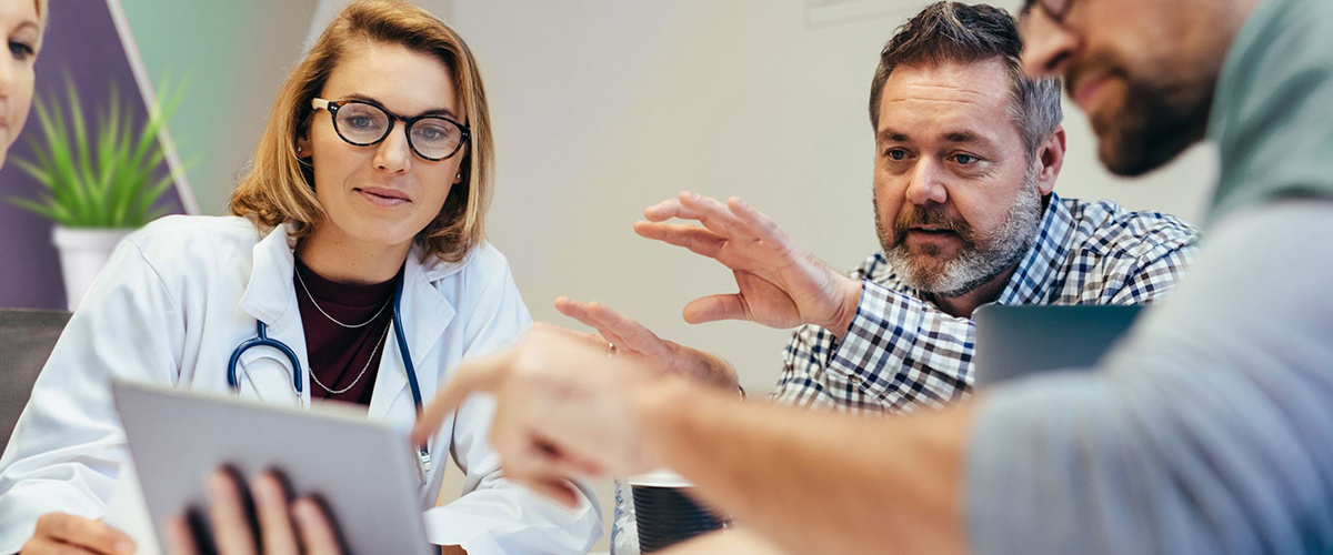 Group of healthcare providers sitting at a table working