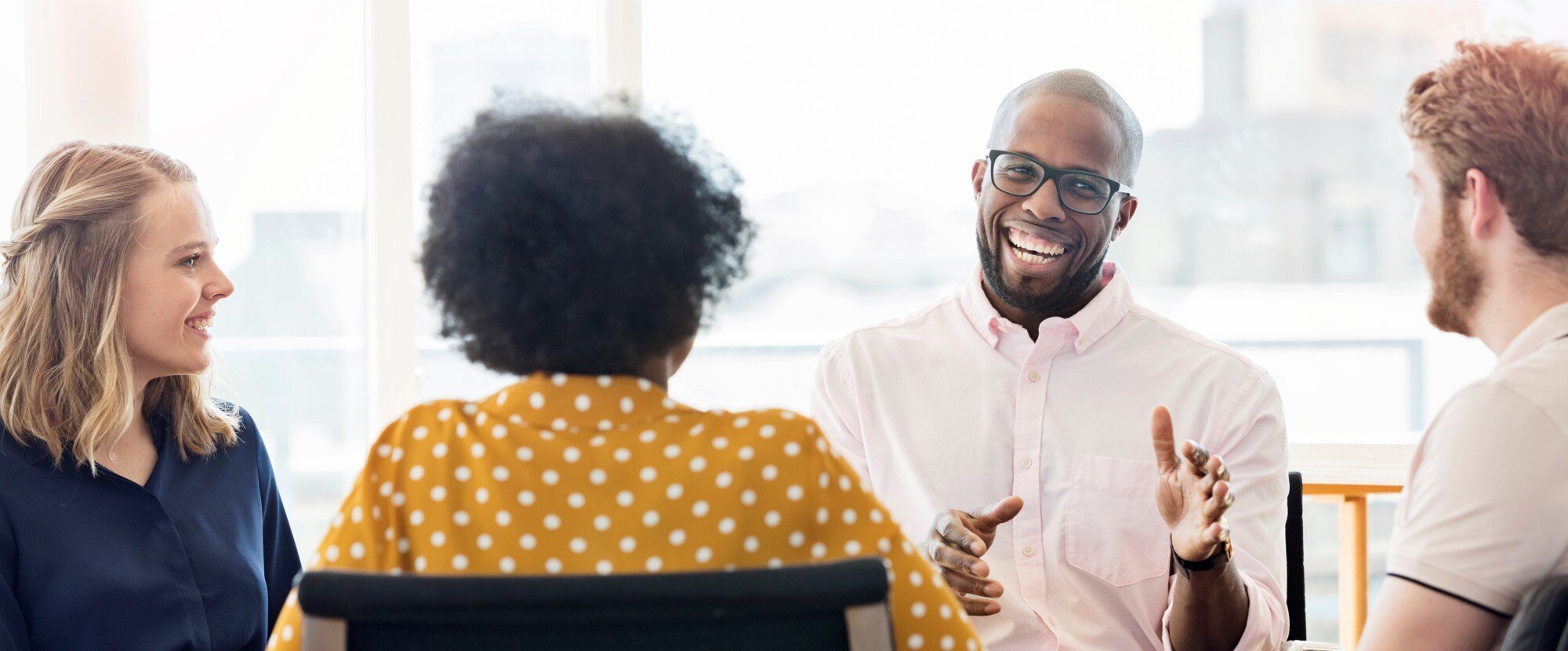 colleagues laughing together at work