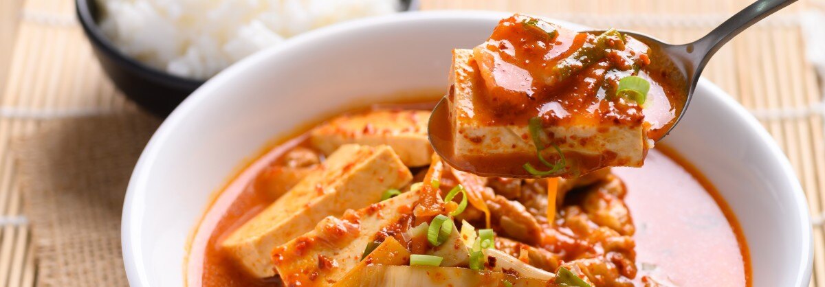 Kimchi stew with a bowl of rice