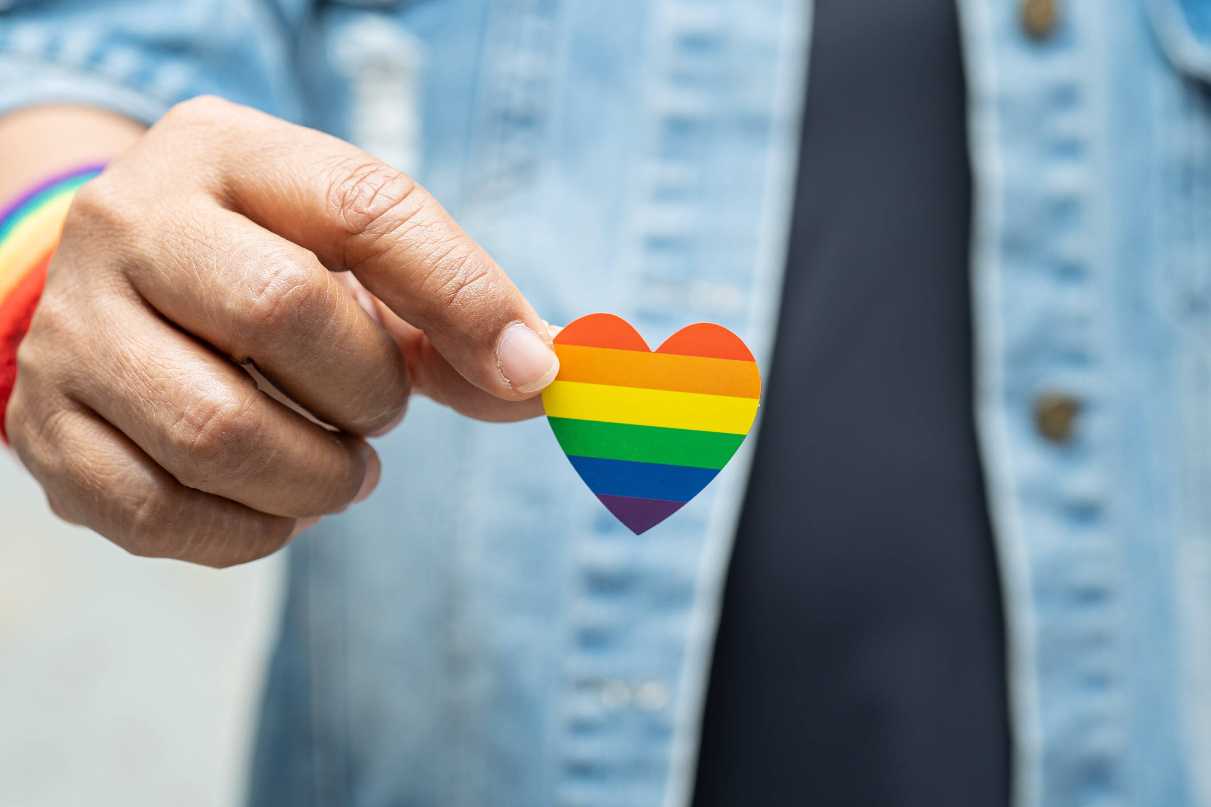 Man holding pride heart