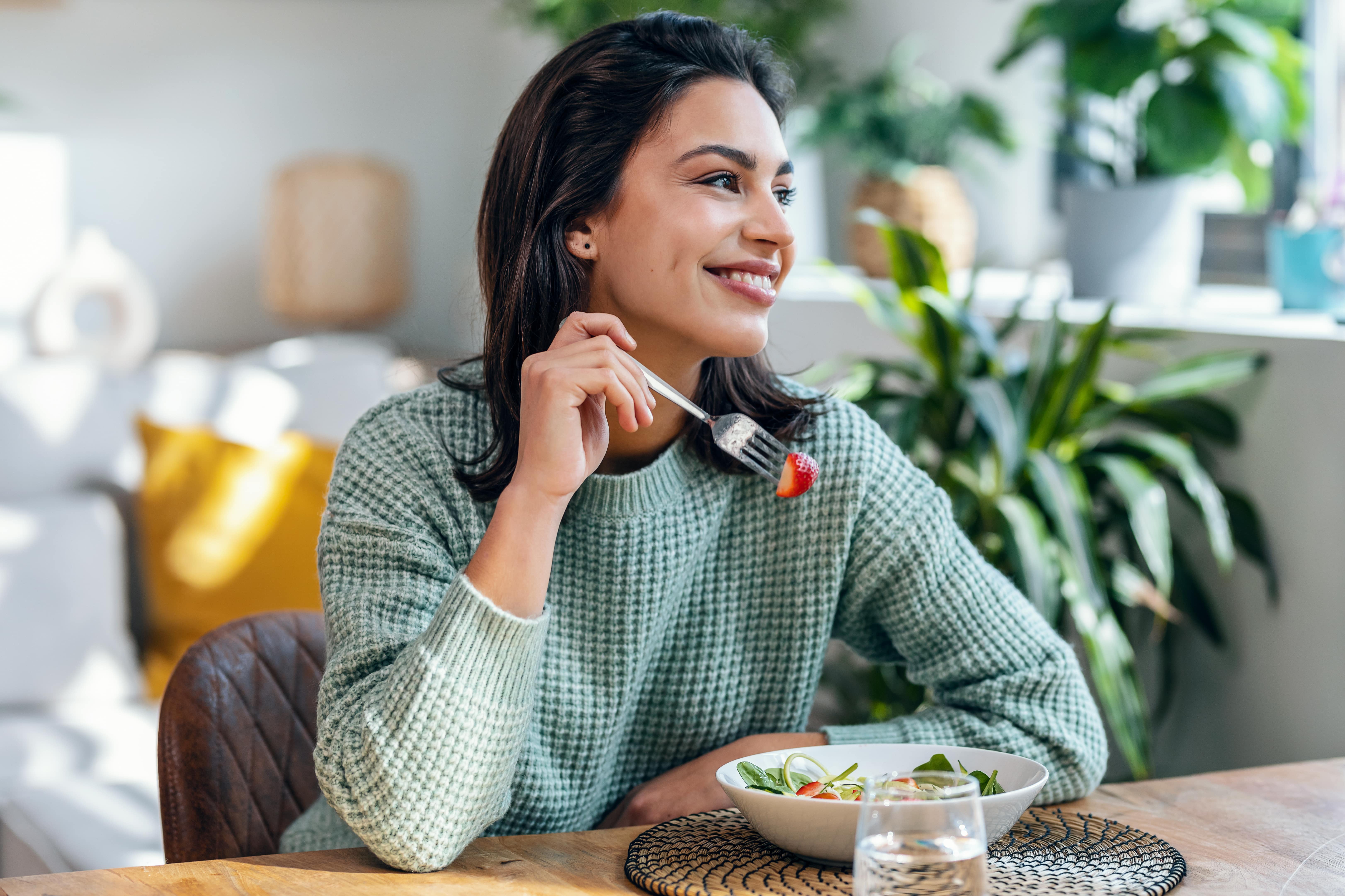 Woman eating a strawberry