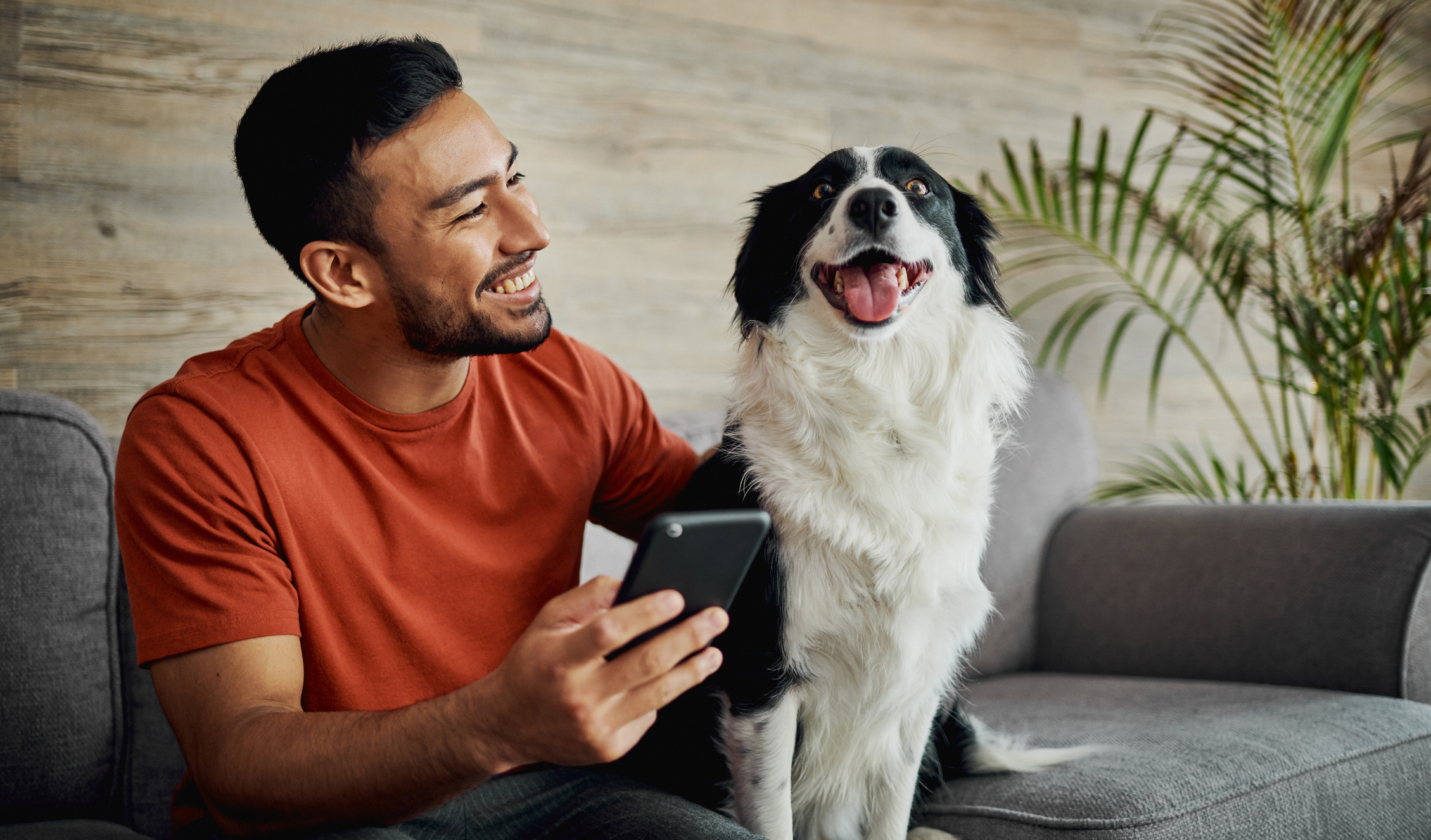 Man with his dog on a couch 