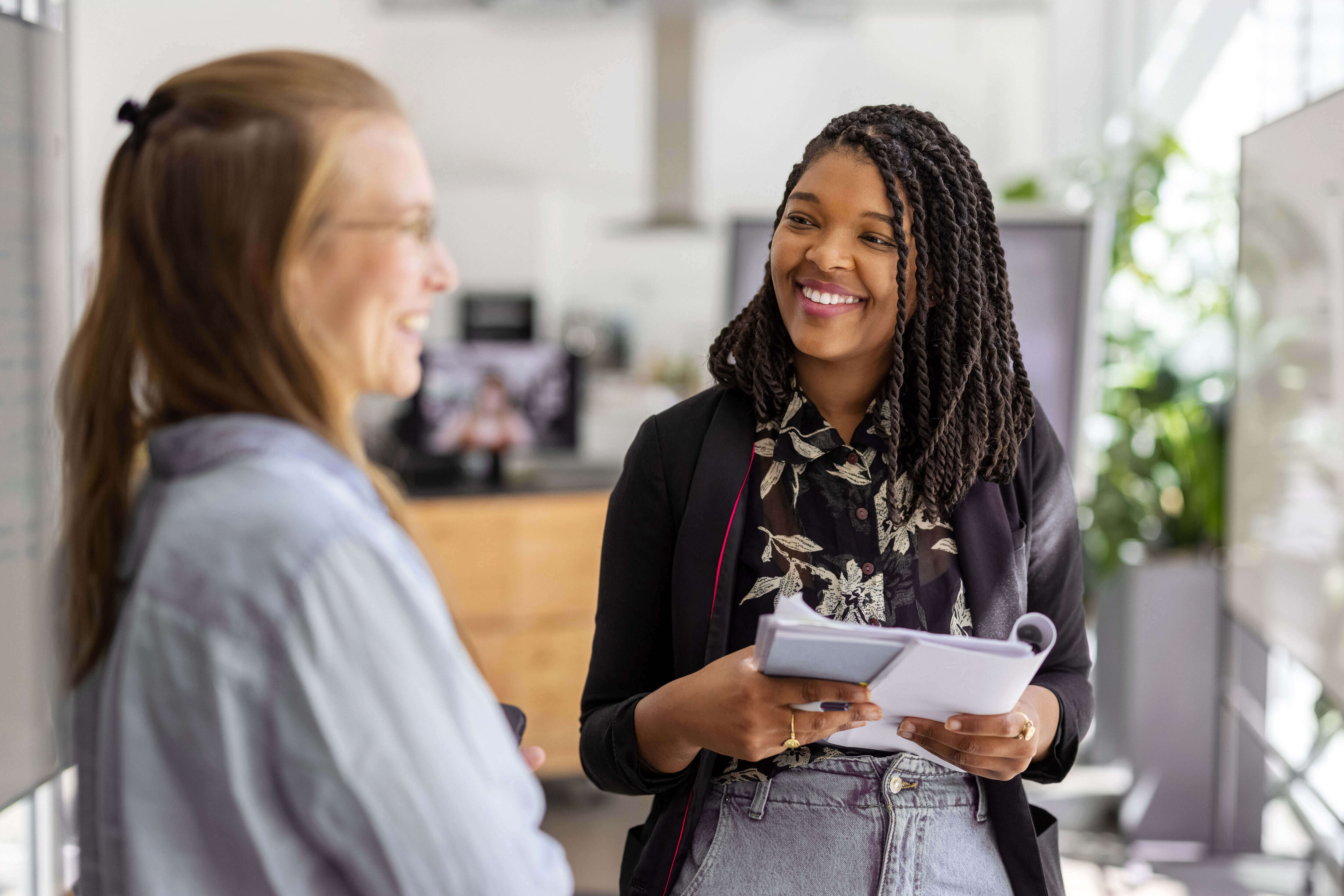 women smiling having a conversation