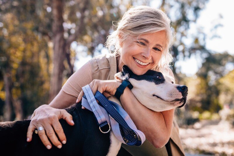 Woman with her dog in the park