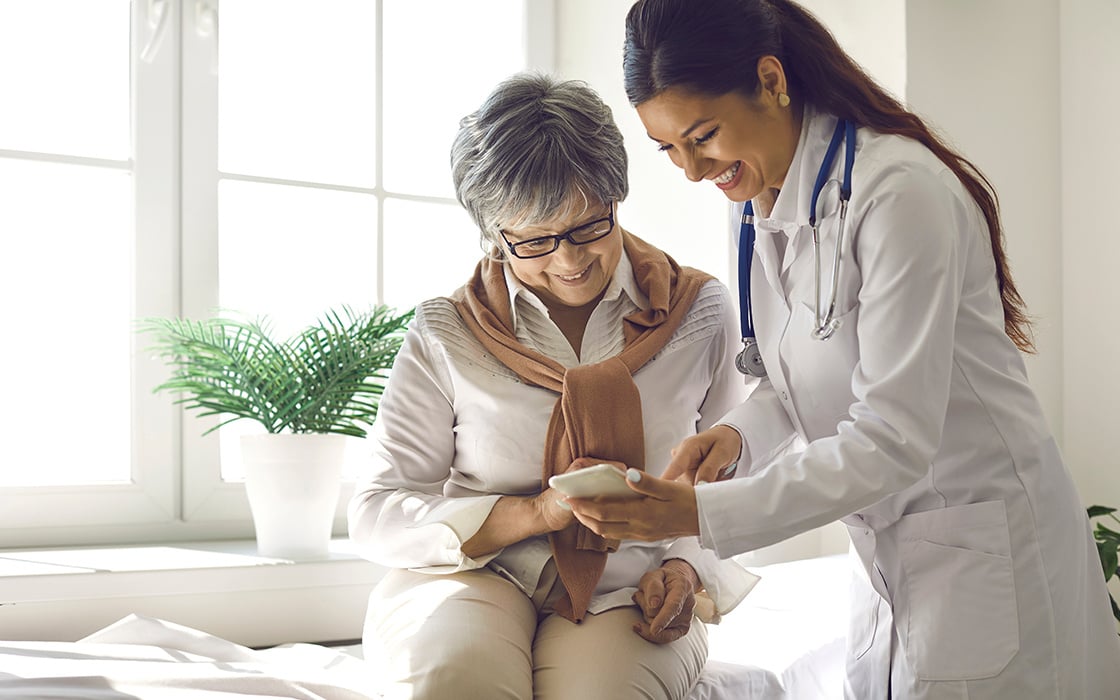 Doctor and patient looking at a smartphone